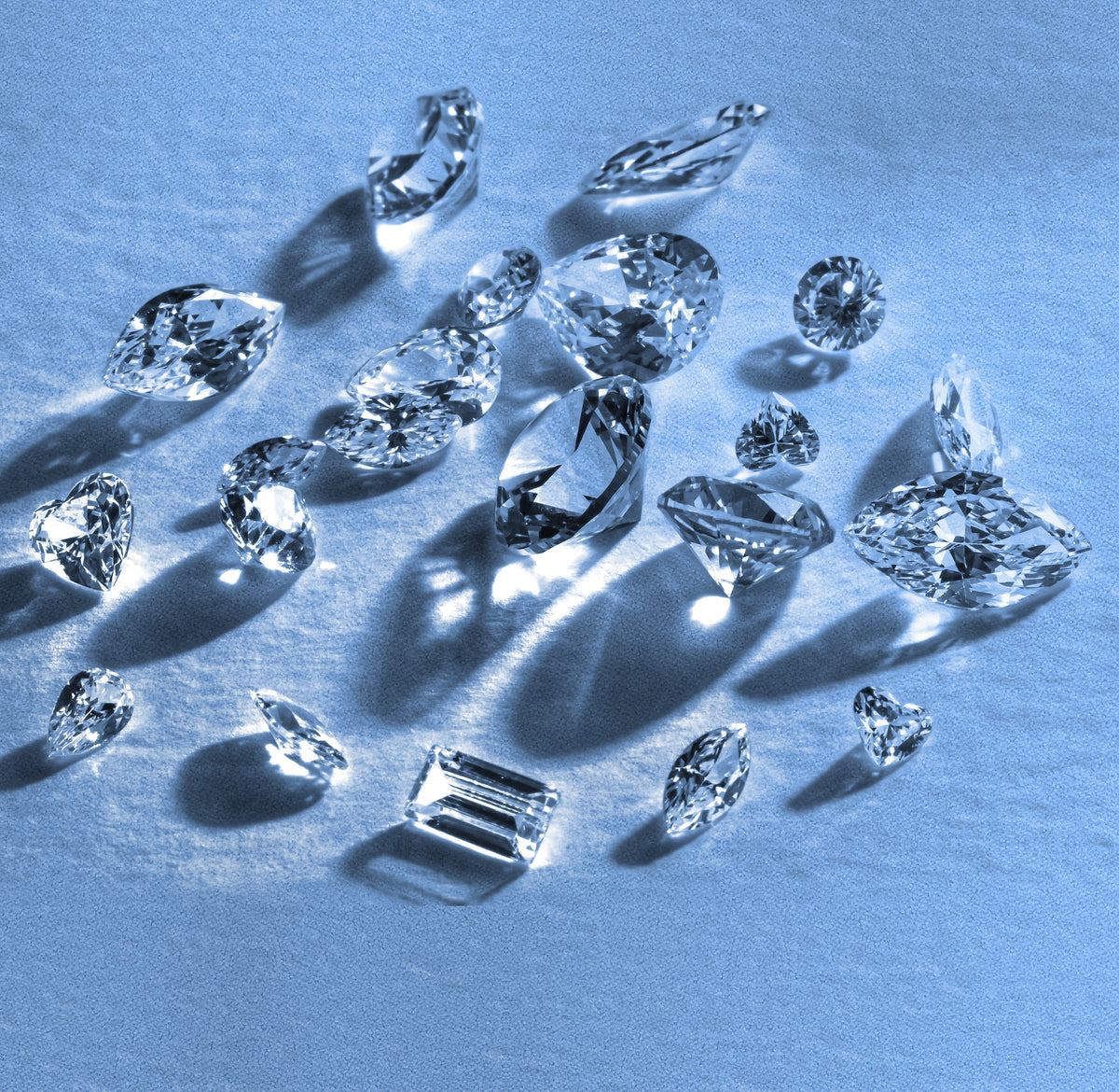 Loose diamonds being sorted on a workbench